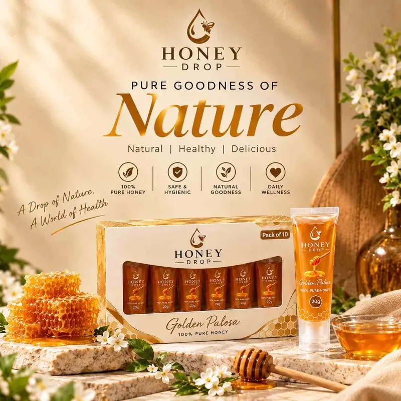 Honey Drop Golden Palasi tube and box set displayed on a rustic stone surface with honeycomb, flowers, and honey bowls in a warm, natural setting.